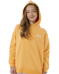 The Rip Curl Girls Girls Surf Puff Heritage Hoodie in Orange