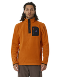 The Rip Curl Mens Anti-Series Search Polar Fleece in Orange Amber