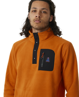 The Rip Curl Mens Anti-Series Search Polar Fleece in Orange Amber