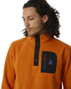 The Rip Curl Mens Anti-Series Search Polar Fleece in Orange Amber