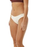 The Rip Curl Womens Block Party Spliced Cheeky Hip Bikini Bottoms in Bone