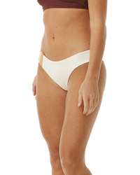 The Rip Curl Womens Block Party Spliced Cheeky Hip Bikini Bottoms in Bone