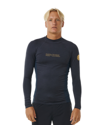 The Rip Curl Dawn Patrol UPF Performance Long Sleeve Rash Vest in Navy Marle