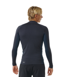 The Rip Curl Dawn Patrol UPF Performance Long Sleeve Rash Vest in Navy Marle