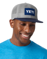 The Yeti Mens Velcro Badge Flat Brim Mesh Cap in Grey & Navy