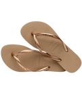 The Havaianas Womens Slim Logo Metallic Flip Flops in Rose Gold