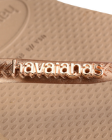 The Havaianas Womens Slim Logo Metallic Flip Flops in Rose Gold