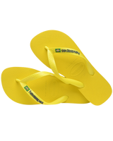 The Havaianas Boys Boys Brasil Logo Neon Flip Flops in Citrus Yellow