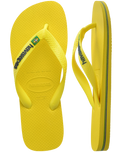 The Havaianas Boys Boys Brasil Logo Neon Flip Flops in Citrus Yellow