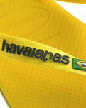 The Havaianas Boys Boys Brasil Logo Neon Flip Flops in Citrus Yellow