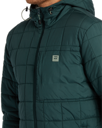 The Billabong Mens Journey Puffer Jacket in Dark Forest