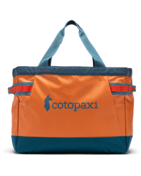 The Cotopaxi Allpa 60L Gear Hauler Tote Bag in Tamarindo & Abyss