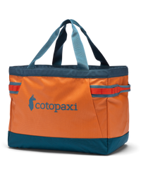 The Cotopaxi Allpa 60L Gear Hauler Tote Bag in Tamarindo & Abyss