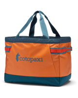 The Cotopaxi Allpa 60L Gear Hauler Tote Bag in Tamarindo & Abyss