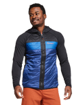 The Cotopaxi Mens Capa Hybrid Insulated Hooded Jacket in Black & Maritime