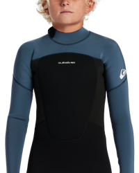 The Quiksilver Boys Prologue 4/3mm Back Zip Wetsuit in Black & Bering Sea