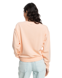 The Roxy Womens Surfing By Moonlight Sweatshirt in Peach Parfait