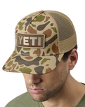 The Yeti Mens Logo Full Camo Trucker Cap in Brown Camo