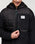 The Cotopaxi Mens Trico Hybrid Hooded Jacket in Cotopaxi Black