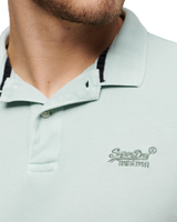 The Superdry Mens Destroyed Polo Shirt in Surf Spray Green