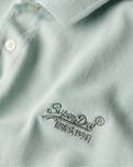 The Superdry Mens Destroyed Polo Shirt in Surf Spray Green