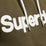 The Superdry Mens Core Logo Hoodie in Black Olive Grit