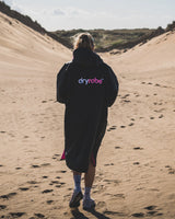 The Dryrobe Advance Short Sleeved in Black & Pink