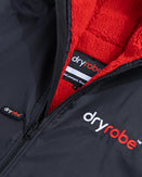 The Dryrobe Advance Long Sleeved Dryrobe in Black & Red