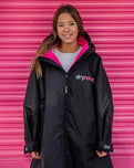 The Dryrobe Kids Advance Long Sleeved Dryrobe in Black & Pink