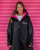 The Dryrobe Kids Advance Long Sleeved Dryrobe in Black & Pink