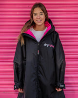 The Dryrobe Kids Advance Long Sleeved Dryrobe in Black & Pink