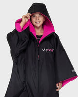 The Dryrobe Kids Advance Short Sleeved in Black & Pink