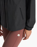 The Vuori Womens Outdoor Trainer Shell Zip Jacket in Black Heather