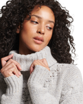 The Superdry Womens Chunky Cable Roll Neck Jumper in Off White